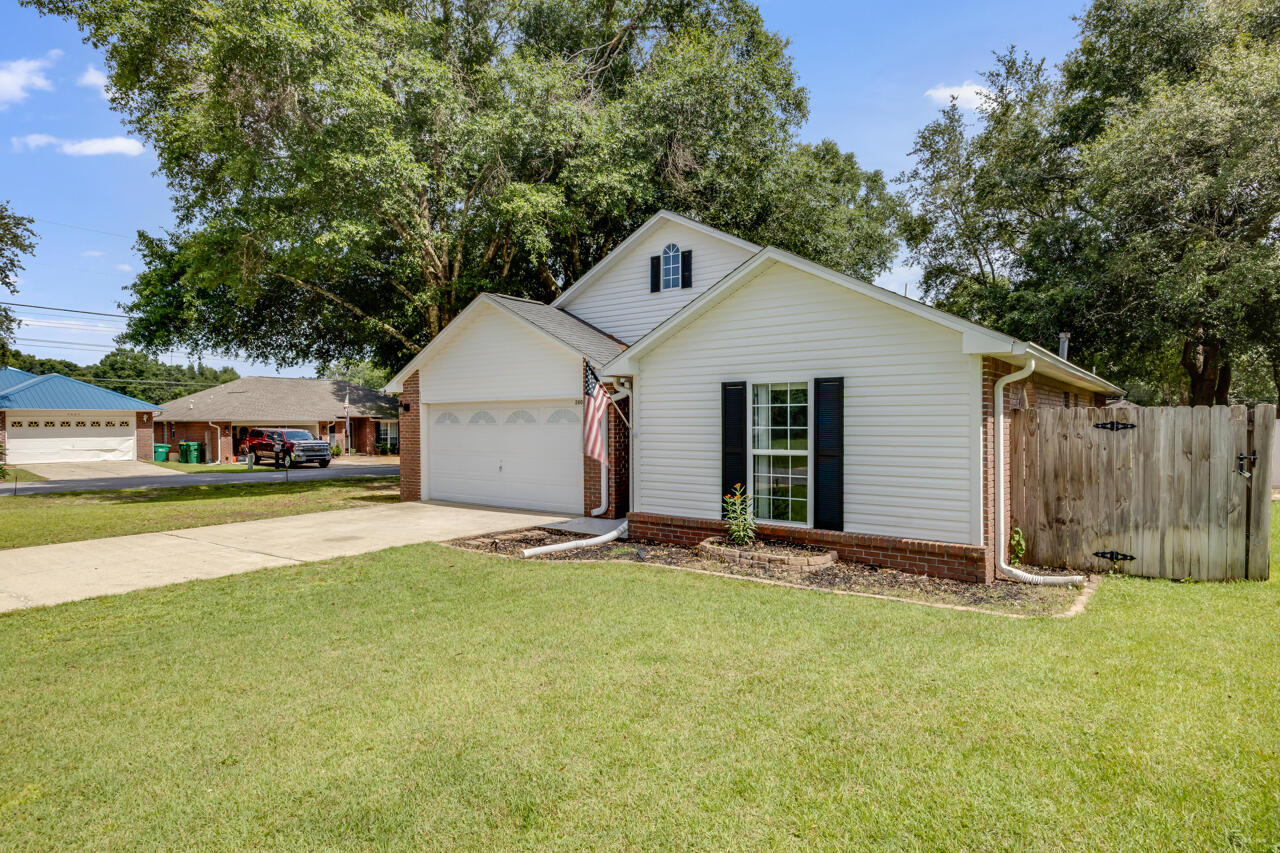 There is so much to love about this home situated on a corner lot in South Crestview. A split floor plan, stylish kitchen with stainless steel appliances, a natural gas fireplace in the family room and beautiful flooring that flows from the foyer into the common areas. The backyard is fenced in and has an open patio for outside entertaining. See it today!