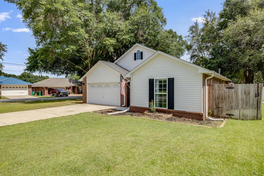 There is so much to love about this home situated on a corner lot in South Crestview.  A split floor plan, stylish kitchen with stainless steel appliances, a natural gas fireplace in the family room and beautiful flooring that flows from the foyer into the common areas.  The backyard is fenced in and has an open patio for outside entertaining.  See it today!