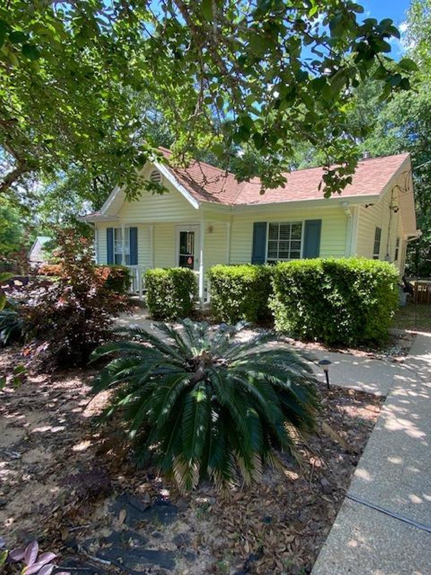 Cute Cottage! This 2 bedroom 1 bath home situated on a large corner lot offers a breakfast bar, hardwood floors and tile in bathroom, covered porch and storage shed.