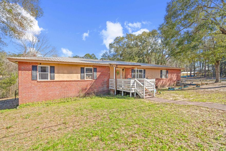 'This property comes with a 2-1 rate buydown, reducing the buyer's interest rate by 2% for the first year of their loan and 1% the second year. Buyer is not obligated to use Amy Harvell of CrossCountry Mortgage to have offer accepted however must use Amy Harvell to receive the buydown contribution. Team Harvell can issue underwritten loan approvals in as little as 5 days and close in 10. Restrictions apply. Team Harvell NMLS1752706.' This 4-bedroom, 2-bathroom home offers 1,780 sqft of living space with a peaceful setting on a spring-fed pond. Built in 1972, it has a solid structure and plenty of potential for updates to make it your own.

The home features a functional layout with spacious bedrooms and main living areas that offer views of the pond. The primary bathroom includes a huge handicap-accessible shower, providing added convenience and accessibility. Outside, enjoy the quiet surroundings and the opportunity to fish or relax by the water.

If you're looking for a home with great potential in a waterfront setting, this could be the perfect fit. Schedule your showing today!