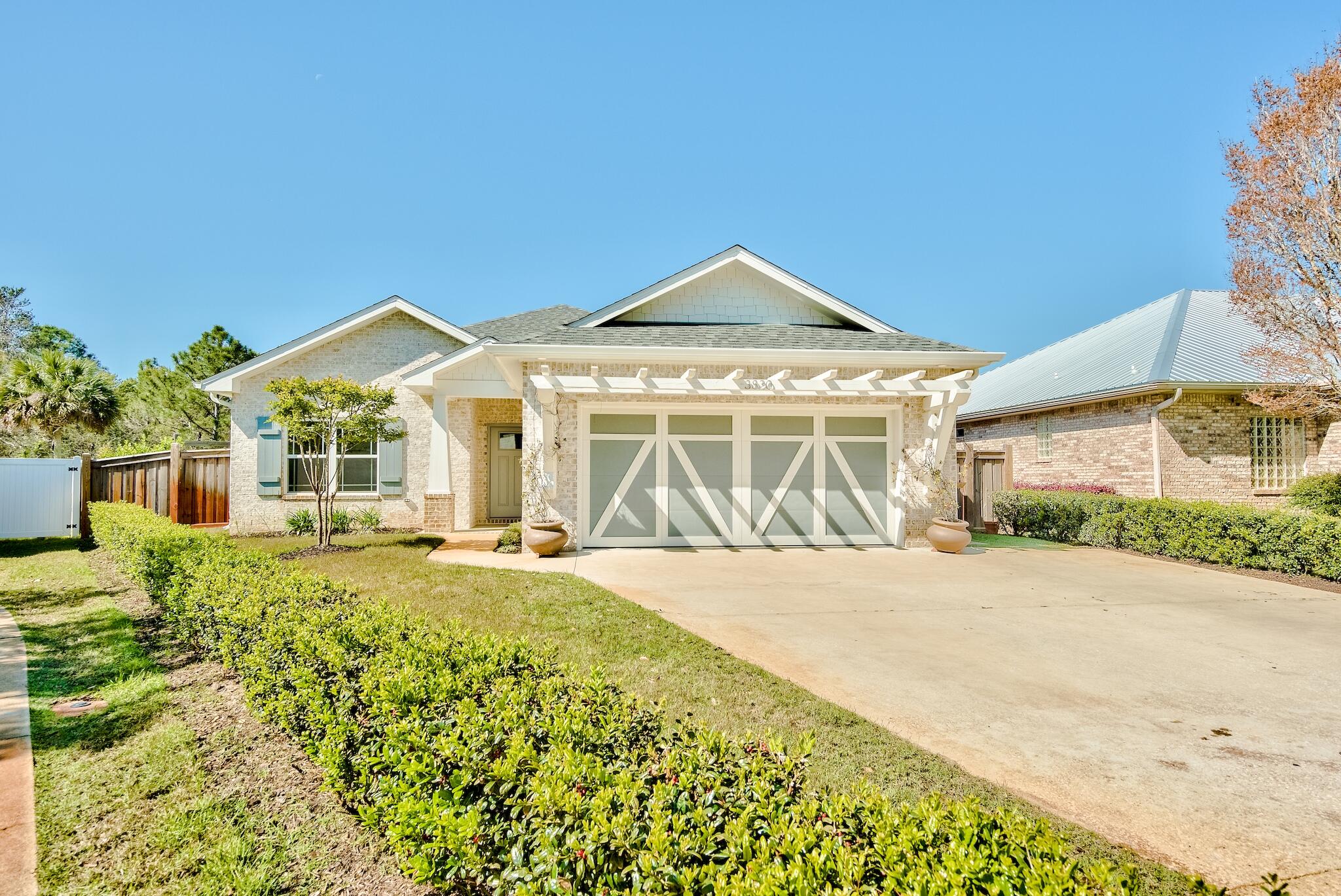 Absolutely gorgeous, 2017 custom built home in the heart of Destin. Built by quality local builder RAK Construction, this exquisite home offers many features and upgrades throughout! Upon entering the house you will immediately notice the custom wood beams and fixture in the foyer. Attractive tile floors are throughout the living area, kitchen, dining and baths, with soft carpeting in the bedrooms. The living room offers built-in book cases and flows right into the kitchen and dining space. Kitchen features include quartz counters, walk-in pantry, and stainless steel appliances. Features of the master suite include a brick accent wall, custom tray ceilings, large shower with rainhead faucet, and unique subway tile backsplash that runs the entire wall. Other features and upgrades of this