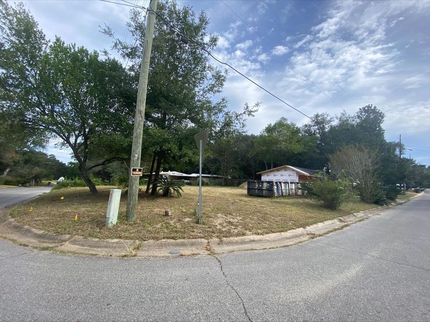 Nice large corner lot on beautiful waterfront street. Seller left one of the garages standing when she bulldozed the original house. There is a custom home plan that buyer can have with sell of property if interested. Listing agent is related to seller. Listing information should be verified by buyers.