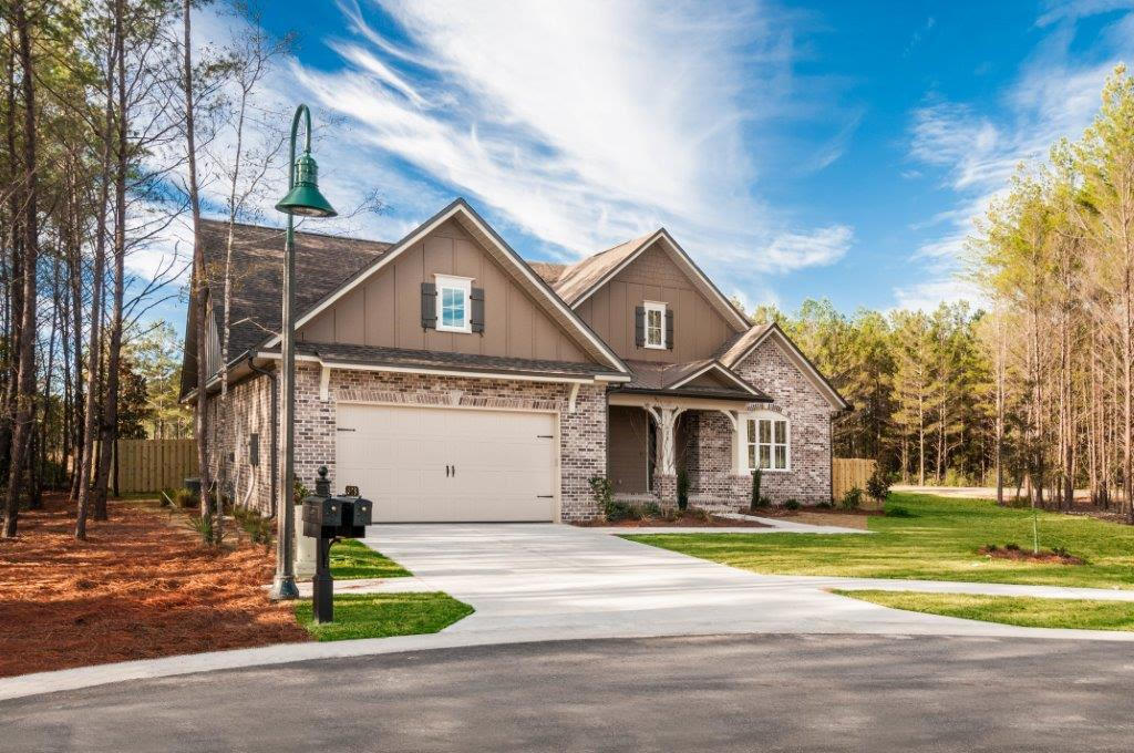 Pre sold home. Live Oak plan has 2,598 square feet, three bedroom, plus a study and 2 baths. Master bath has tiled shower and drop in tub with tile surround. Brick exterior, extended rear porch and a 2 car garage. Interior finishings include, 9' ceilings, granite counter tops, laminate floors throughout entire house, cased openings, crown molding and cased windows in main living areas and master bedroom. Additional upgrades include tile tub in bath 2, french doors to dining room and flex room along with floor plug in living room. Back porch is extended, screened in and has a ceiling fan. Natural gas range and Rannai tank water heater. Stainless Frigidaire appliances, WoodHarbor cabinets with 100 year finish warranty.