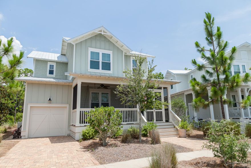 This four bedroom three bath home with one car garage is a must see! Home is being offered fully furnished! This home features pine floors throughout, fireplace in the living room and coffered ceilings in the dining area. The kitchen is equipped with granite counter tops, white glazed cabinets, and GE Cafe' appliances and a wet bar with ice maker. This home has 3 porches and the front porch is screened as well as the porch on the second floor off of the bunk room. The back porch is open to the large brick paver patio with fire pit over over looking the nature preserve! This is a must see!