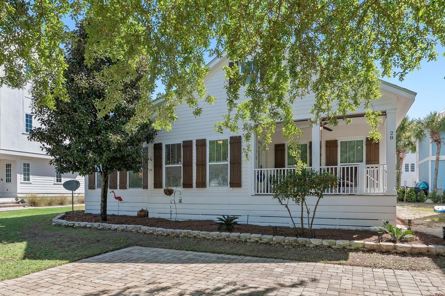 Incredible opportunity to own this exceptional upscale beach cottage within the charming gated community of The Village at Blue Mountain Beach! Blue Mountain Beach is famous for its serene beaches, amazing elevations and lively local culture. There is great curb appeal with the paver stone driveway, shutters and quintessential front porch. Upon entering you are greeted with beautiful pine flooring & stunning craftsman details like floor to ceiling wainscoting & shiplap walls. This home is beautifully furnished with gorgeous furniture & decor and has been updated with Quartz countertops and modern, yet elegant lighting throughout. The kitchen features tile backslash all the way to the ceiling, Quartz island with built-in wine rack, brick accent and additional storage & elevated appliances.