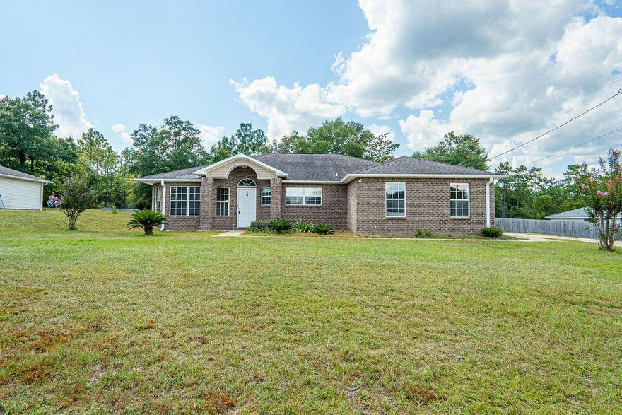 Charming Crestview Home for Sale! Built in 2007, this spacious single-family residence is a perfect blend of comfort and style. The home features 3 bedrooms, 2 bathrooms, and a 2-car garage. Inside, you'll find an open floor plan with tile flooring throughout the main living areas and carpeting in the bedrooms. The living room has cathedral ceiling and plant shelves, creating an airy and oversized feel. The kitchen is large as well and has that open and airy feeling including a space for a breakfast nook. Kitchen island is convenient and is perfect for meal prep and entertaining. Conveniently located, this neighborhood is less than 4 miles from Crestview High School and a must see. Call today!