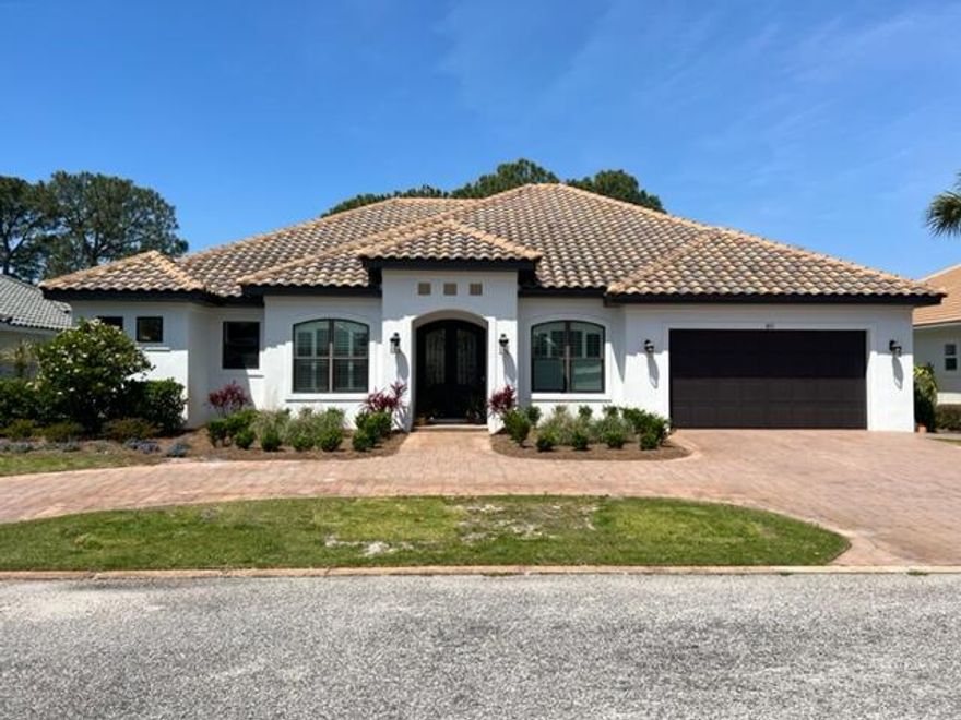 Custom Home on the 17th fairway of Emerald Bay. Relax on the lanai with outdoor fireplace, summer kitchen, heated pool and spa. Large open kitchen and living room are designed with entertaining in mind!  Home also boasts 10' ceilings and hurricane rated impact windows along with 8' interior and exterior doors. Wonderful kitchen with twin islands, double oven and built in ice maker.  Views of the bay from the backyard.  The home has 3 bedrooms, with a flex room in the front of the house, which is currently an office, could be transformed to a 4th bedroom or playroom.  Don't miss this one, it's sure to go fast!