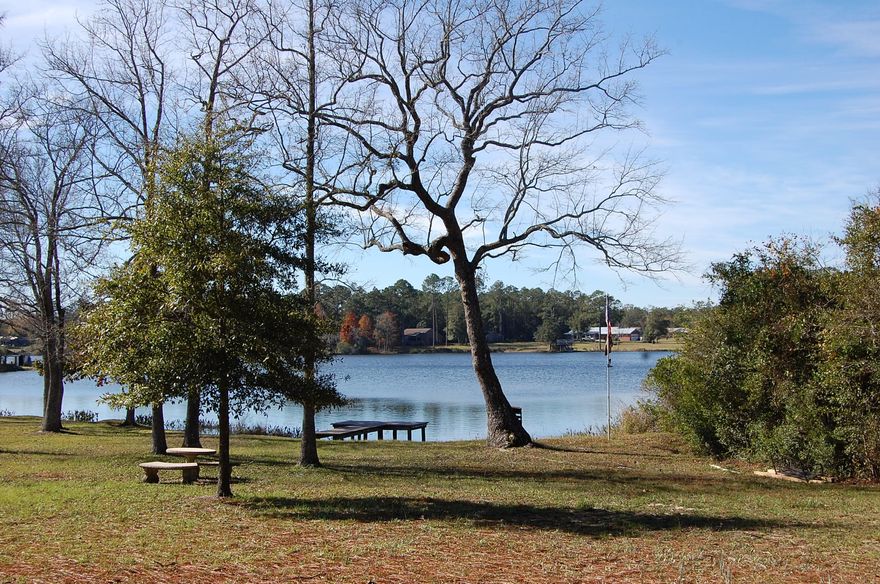 Motivated Seller! Lake Front! This beautiful updated home sits on 1.8 acres just a few minutes from downtown. Bring your boat and ski! Sit on your dock and fish or go for a swim!   Have friends over for a cookout and enjoy the good life!Present owner has completely moved the kitchen to the 40' living/family room and features all new granite counters, loads of brand new cabinetry, and all stainless sinks, dishwasher, gas range, refrigerator and microwave. Large island with more cabinets and granite counter. The Kitchen opens to the spacious living room with an electric fireplace and double doors leading to back yard with a newly installed fence for doggies. The original kitchen is now a beautiful updated dining room featuring a built-in buffet, canned lighting and gorgeous, looks like wood vinyl floors!
The master bedroom is oversize with  room for a desk and workout equipment. Master bath has a step-in shower.
The other 2 bedrooms  and a brand new bath room are on the other side of the home!  There is a room in front of the home that is used as a study! And has a wood burning fireplace. It would be perfect for a pool table, playroom or office!
 The 24'x24' workshop has electric and could easily be converted to a nice rental unit. There is a covered parking area in the back for a boat and also a covered area to store wood for the fireplace!
The back patio is also covered! The lake is beautiful and you have your own dock to sit out and enjoy the view of your new home and peaceful surroundings!
Call us today for an appointment to see this lovely home!

Buyers to verify all measurements and pertinent information.