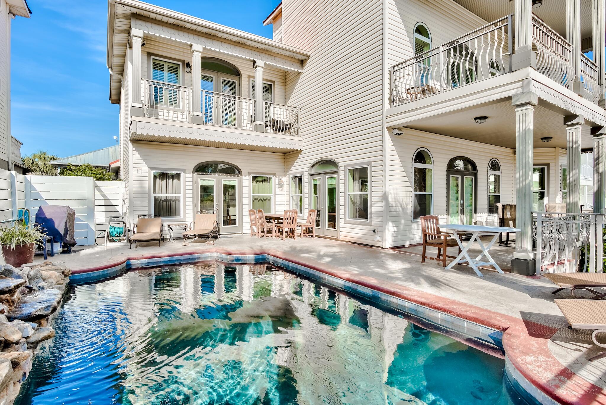Beautiful gulf views from every single level of this home, including the first! Perfectly positioned on Scenic Highway 98 in Crystal Beach. This 5 bedroom and 5 bathroom large luxury beach estate is a unique, income producing second home with an exceptional number of parking spots and close proximity to the beach. Both the stylish outdoor oasis with a large pool area and the open-concept interior, makes this home an ideal property for entertaining all your guests. Notice the level of detail throughout this home from vaulted ceilings in the master bedroom to the exquisite crown molding. The custom converted garage serves as a one-of-a-kind game room/bedroom with craftsman style bunk beds which can be appreciated by guests of all ages. Rental projections exceed $220,000.