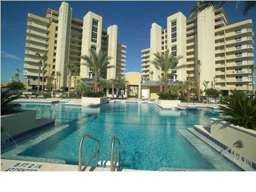 Beautiful 5th floor north end unit with panoramic unobstructed western views from the living room and master bedroom of the harbor, gulf and Okaloosa island. The floor plan is open and functional with many upgrades, granite counter tops and custom cabinetry. There is access to the large balcony from both the living area and master bedroom. Also, there is a spacious balcony off guest bedroom two. Both balcony space is 720 sq ft. Special features include a gated entrance, two pools with hot tubs, cabanas, spacious fitness/club room, outdoor gas grills, outside storage space, assigned indoor parking (P-2) under the building, full time on site maintenance personnel and deeded beach access between Oceania and Martinique. A 20X40 boat slip can be purchased separately. Harbor Landing