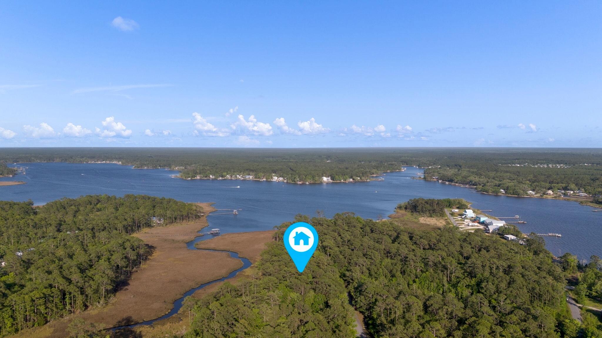 Welcome to your slice of waterfront paradise in the heart of Freeport, Florida! This lot offers breathtaking views overlooking a natural salt marsh, providing a serene backdrop for your dream home. Nestled on a quiet cul-de-sac with mature trees, you'll enjoy peace and privacy while still being close to the vibrant community. Connected to the Intracoastal Waterway, Lagrange Bayou offers endless opportunities for waterfront living. Centrally located for easy access to Grayton State Park, South Walton Beaches, major highways, schools, and the Freeport Regional Sports Complex, you'll have easy access to all the area has to offer. With underground utilities, these lots provide the perfect canvas for your coastal retreat. Lots 22 (948127) & Lot 21 (948131) also for sale but sold separately
