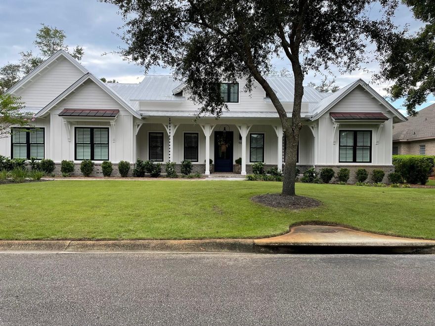 96 Grand Flora Way is located in the gated, waterfront community of Botany Bayou.  Featuring a spacious Living-Dining-Kitchen area; 3 Bedrooms; 2 1/2 Baths; one level, split floor plan.  The gourmet kitchen features Sub-Zero Refrigerator and Wine Refrigerator; Wolf Oven, Wolf Speed Oven and Wolf 6 Burner Stove; Cove Dishwasher; Quartzite countertops; GE Refrigerated Beverage built-in Drawers and Custom designed interior cabinet drawers.  West Palm Engineered Hardwood floors in all living areas with tile in the bathrooms.  Living Room features remote control Gas Fireplace with Venetian Plaster fireplace surround and Mirrored Door Built-In Cabinets.  Large Screened Porch with Commercial Grade Outdoor Kitchen - Naturekast Counters and Cabinets - Lion Grill - Wood Burning Fireplace - Ceiling