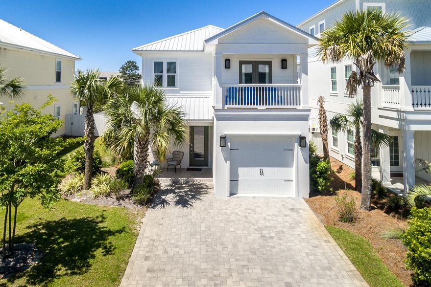 Located in a gated community and walking distance to the beach, this gorgeous home that sleeps 12 comfortably was built in 2017 and is the perfect investment property and also great for full time living. On the first floor you'll enjoy the open spacious floor plan with a bedroom and full bathroom on the main floor. The kitchen comes equipped with granite counter tops, stainless steel appliances, sizable walk-in pantry, soft close doors and drawers and breakfast bar. The second floor holds 3 additional bedrooms and bathrooms. The master suite has a large walk-in closet and the bathroom has his-and-hers vanities, walk-in shower and garden tub. Other notables are gorgeous wood floors, all house blinds, tasteful lighting throughout the home, mounted flat screens in every bedroom, walk-in close