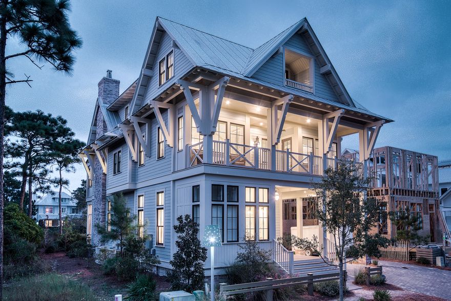 Outstanding WaterColor home with standout features including inviting brick archways, Venetian plaster walls, 14' first floor ceilings, white oak hardwood floors, an elevator and an outdoor living area complete with a summer kitchen and a beautiful brick fireplace. Designed by T.S. Adams Studio, this contemporary style residence offers over 4,000 sqft of comfortably designed living space with 7 bedrooms and 7.5 bathrooms. Perfect for entertaining, the first floor has a spacious great room, lovely dining area and gourmet kitchen with top of the line appliances and an expansive breakfast bar. A secondary master suite with private bathroom is also located on this level. The exquisite second floor master suite offers a private sitting area, private porch and luxurious master bathroom. Two large guest rooms with private bathrooms and porch access complete the second story. The third floor includes a fully equipped theater room, a guest room, two bunk rooms with built-in beds, an office or additional bedroom and a porch. Experience the serene lifestyle of WaterColor at its finest with nearly 1,350 square feet of porches, an open terrace and covered pergola. Located on 499 acres in the renowned South Walton Beaches, WaterColor was created with families in mind and offers the charm of small town life. Exceptional community amenities include several beautiful swimming pools, a gulf front beach club, nature trails, kayaking, canoeing, a fitness center, tennis, Camp WaterColor for kids, parks and green spaces.

