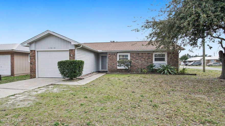 Centrally located, on a large lot, this beach home has a new roof and is move in ready with plenty of room to expand for a large family or add a pool in the backyard. This home offers 3 bedrooms and 2 baths plus a single car garage for your car or storage. Your children can conveniently walk one block to school at Beach Elementary and the middle and high schools are within a few miles for quick drivability and access. Wonderful location close to the beach, the County Pier, shopping, Pier Park and Frank Brown Park for all your extracurricular activities. Short term rentals are not permitted in this area. This house will not last long, so call today for your own private showing. Please verify room measurements if important.