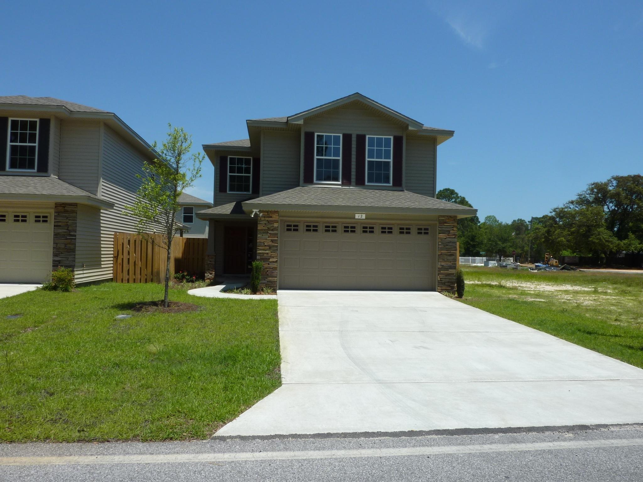 BE THE FIRST TO LIVE IN THIS BRAND NEW HOME - CONSTRUCTION COMPLETE! WELCOME TO BEAUTIFUL SUMMERWOOD, A NEW SHALIMAR SUBDIVISION. SO MANY UPGRADES! *******THIS HOME FEATURES IMPACT GLASS WINDOWS.****** THE EXTERIOR OF THIS HOME HAS CLASSY STONE ACCENTS & DIMENSIONAL SHINGLED ROOF. ENERGY EFFICIENT & TOTAL ELECTRIC. ATTRACTIVE KITCHEN OFFERS STAINLESS STEEL APPLIANCES INCLUDING DISHWASHER, RANGE & MICROWAVE, PLUS QUALITY CABINETS, PANTRY AND GRANITE COUNTER TOPS. STAIN-RESISTANT CARPETING & CERAMIC TILE. RAISED PANEL COLONIAL DOORS. BATHS HAVE CULTURED MARBLE LAVATORIES. MASTER BATH HAS DOUBLE VANITIES, A GARDEN TUB, AND DUAL WALK-IN CLOSETS. SPACIOUS MASTER BEDROOM FEATURES A SITTING AREA, PERFECT FOR RELAXING WITH A BOOK. HUGE LIVING ROOM