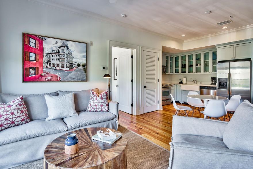 Completely remodeled and turn key ready!
Your will fall in love with the coziness of this condo which sleeps like a 2 bedroom with 2 full bathrooms. Polished hardwood flooring and tasteful decor greet you as you step through the door of this sought-after condo in the heart of Rosemary Beach. Competitively priced to sell, this luxury residence is the most inexpensive condo available in Rosemary Beach and the new furniture gives it a fresh finish. The custom wall bed folds effortlessly away into a custom built-in cabinet, maximizing the potential of this one-bed, two-bath condo which easily sleeps four. The corner kitchen area is fully equipped with stainless appliances, a Belfast sink and a full range of cabinets in soft dove gray. New white quartz countertops are in place. You'll find everything you need to cook a romantic dinner or fix breakfast before a day at the beach. spacious open floor plan includes a dining table and a well-lit sitting area with deep cushioned sofa and armchairs for enjoying the pleasant view. French doors open onto a balcony which delivers peaceful views of the treetops on Barrett Square and the unique architectural rooflines. Shop and dine in the elegant Town Center, cool off in the community pools, or enjoy a stroll along the sugar-white sand beach. This prime location in the award-winning community of Rosemary Beach makes this condo a popular vacation rental, generating $46,000+ income in 2018. With a new air-conditioning unit and new water heater, this condo is ready to welcome new owners or another season of guests.