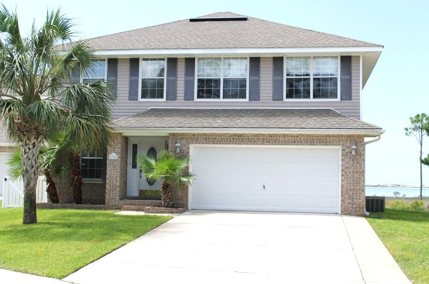 Fantastic move in ready home with incredible views of Santa Rosa Sound! Nice sized kitchen with lots of counter top space, custom cabinets with crown molding, tumbled stone back splash, step up breakfast bar, walk in pantry, recessed lighting and upgraded appliances including refrigerator and built in microwave. Large master suite with breathtaking water views featuring a box ceiling with recessed lighting, huge walk in closet, cultured marble vanity, garden tub and separate shower. One bedroom with double french doors and one full bath downstairs. Spanish lace ceilings, designer tile flooring, extensive crown molding. Screened in Lanai with incredible views of the Sound. Very peaceful setting. Hurricane shutters for all windows.