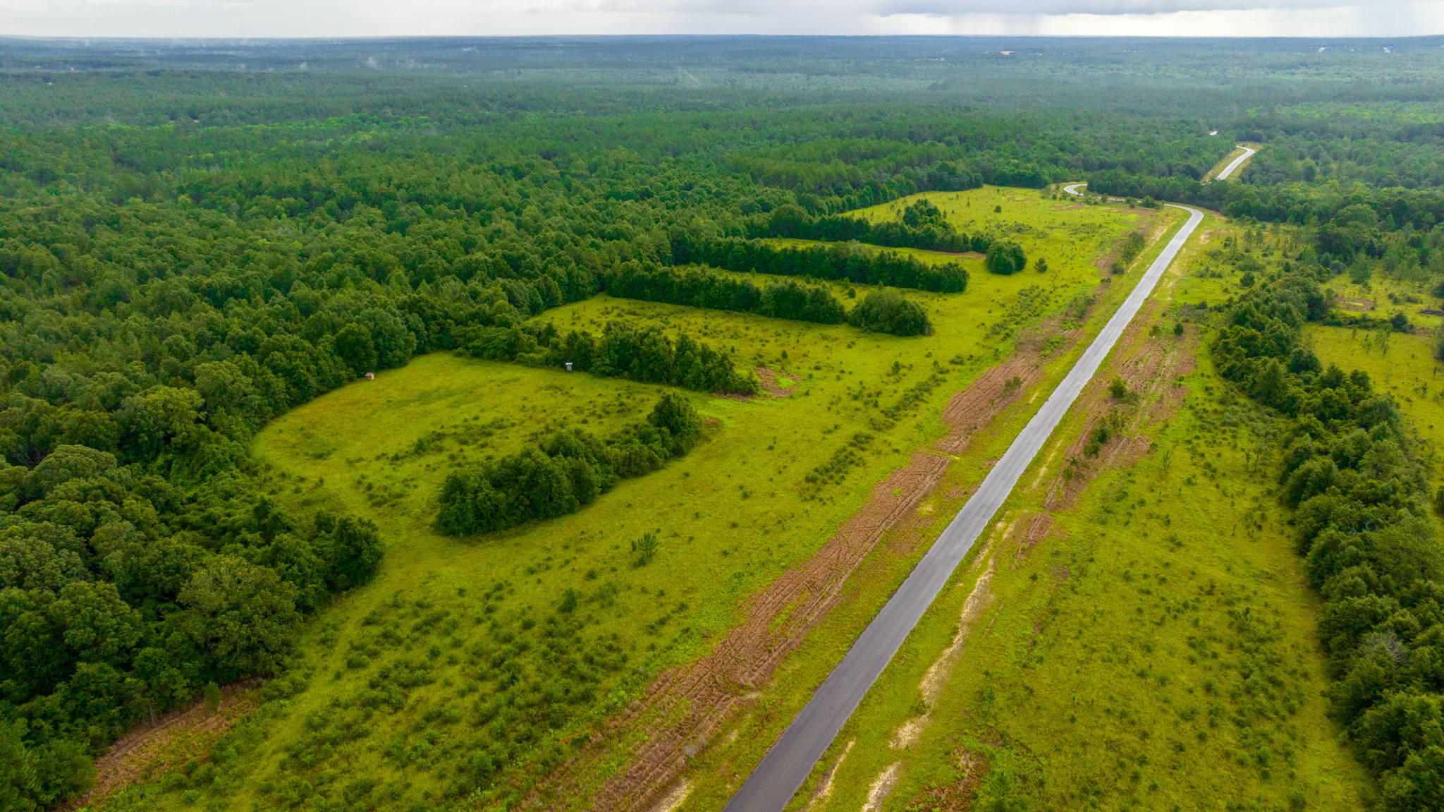 This property is a paradise for farming enthusiasts! With endless opportunities to build your dream home and enjoy the majestic beauty of the land, you won't want to miss out on this one-of-a-kind opportunity. The property has limited covenants and restrictions, And with plenty of space to hunt and ride ATVs, you'll never run out of things to do. Take a moment to relax on the front porch and enjoy the stunning views of the Oak trees, and revel in the convenience of being located in the heart of North Baker, just a short distance from the Baker School, local shopping, and beaches. Don't let this incredible opportunity pass you by!