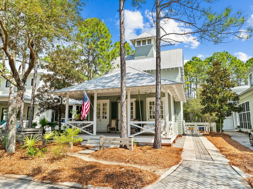 Tucked into one of WaterColor's most desirable Phase II locations, this beautifully maintained home on Thicket Circle offers peace, privacy and quick access to the very best of 30A living. Bordered by a small park in front and green space behind, the setting feels both spacious and serene -- ideal for those seeking a true coastal retreat with every amenity close at hand. A deep front porch, framed by mature landscaping, sets the tone for relaxed mornings and slow evenings. Step inside to a bright, open layout where the front-facing living room flows effortlessly into the dining area and updated kitchen. French doors lead from the dining room to a side deck, perfect for evening grilling or afternoon lounging. Thoughtful built-ins line the hallway, offering practical storage that blends seamlessly with the home's clean design. The primary suite is privately located on the first floor, tucked at the rear of the home for maximum privacy. A walk-in shower and generous layout make it a comfortable everyday escape. Upstairs, two guest bedrooms each feature their own ensuite bathrooms, offering comfort and privacy for visitors or family. A powder room and laundry area on the first floor add to the home's convenience. Outside, the long driveway provides ample parking and a large, fenced-in backyard big enough to add on, if desired.  Whether you're heading to the Camp District playground and pool just around the corner or cruising to the gulf-front beach club, every destination is minutes away. WaterColor amenities include access to multiple pools, tennis and pickleball courts, a lakeside boat house, walking trails, and of course, the gulf-front beach club with dining and panoramic views. Publix, shops, and restaurants in WaterColor and Seaside, Florida, are a short ride away. With its peaceful location, functional layout and strong rental potential, this home is being sold fully furnished turnkey and a rare opportunity to enjoy WaterColor at its finest.