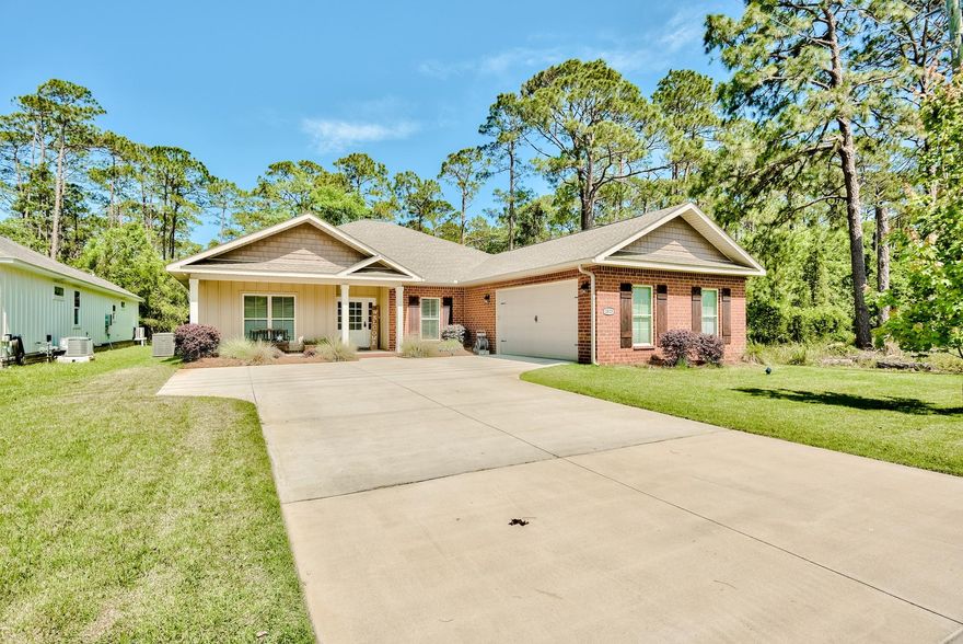 Dreaming of a custom home in the highly sought after Gulf Breeze school district? Look no further. This spacious home features 4 bedrooms, 2 full baths and an office. The pristine attention to detail is showcased immediately upon entry with a grand foyer spotlighting a wood beam casing and tongue and groove ceilings. The open floor plan lives large with high ceilings, extra wide plank flooring and a massive island separating the living and kitchen area making this the ideal space for entertaining. The expansive kitchen is wrapped with shiplap accents and features a walk in pantry, gas range, granite countertops and 11 foot long breakfast bar. All 3 additional bedrooms and one full bath are located on the left wing of the home with the owner's suite privately located on the right wing.