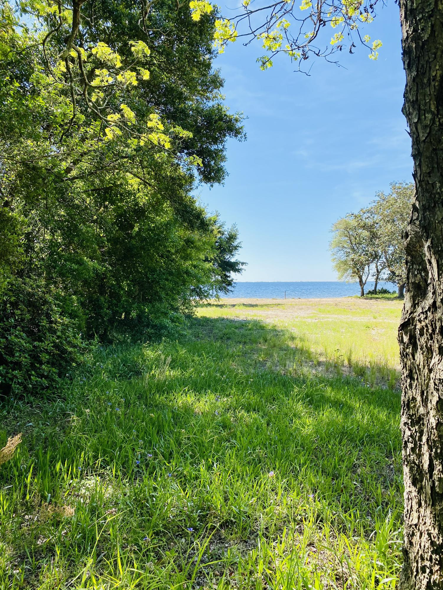 LOCATION, LOCATION, LOCATION. VERY RARE FIND. This deep waterfront lot is perfect for large boat owners and a fisherman's dream. Are you ready to enjoy the sunrise overlooking Choctawhatchee Bay? It has the most beautiful, expansive, and unobstructed view of Destin. Escape to paradise every day watching the dolphins play. Very few deep waterfront lots available with this vast view in a convenient location. It's centrally placed between Eglin Air Force Base and Hurlburt Field. Also, just under 3 miles to FWB Medical Center, schools, shopping, and wonderful local restaurants. Enjoy the area's community fireworks from Niceville to Destin to FWB from your backyard. This well established neighborhood boasts a divided road with mature oak trees and Garnier's Beach Neighborhood Park. It doesn't get any better than this. If you're wanting to build, look no further, you've found the right property. The lot is cleared and leveled with a seawall in place. The seller owns a local construction company specializing in design build and has built a few of the homes in the subdivision. Hire the seller as your builder or bring your own builder and plans. The freedom of choice is yours. Survey is available and included in the listing documents.
Buyer to verify all dimensions and information.