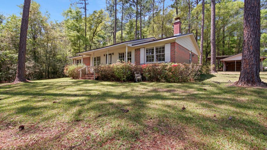 Amazing transformation! New luxury vinyl plank flooring and paint throughout, along with new lighting & vanities. The kitchen has freshly painted white cabinets, new countertops, new appliances and now is open to the living room. Large, light and bright sunroom off the kitchen and dining. In an ideal location, just outside the city limits of DeFuniak Springs, this well established neighborhood offers a great place to call home with no HOA. Sitting on appx 1/3 acre with mature trees and beautiful azaleas. This southern style brick rancher has a brand new roof and the sellers have done most of the work for you. There's a workshop building as well, along with a 3 car carport, all located on a corner lot. The home has been well maintained with one owner for many years. Come see this one today!