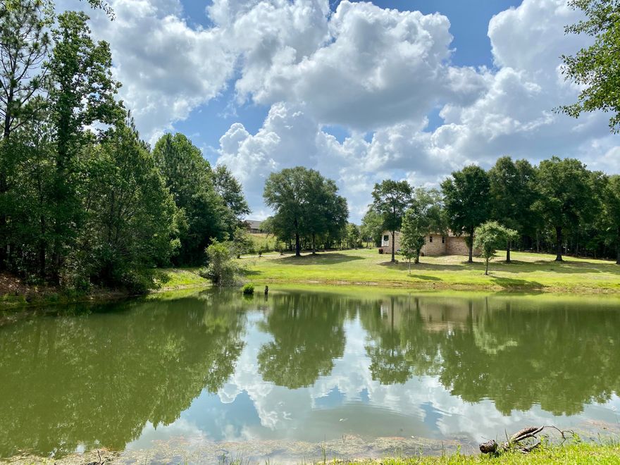 LAKEFRONT, PARK LIKE SETTING, lovingly maintained, move in ready 4 bedroom 3 full bath home on a beautiful 1.37 acre corner lakefront lot! New roof and AC within the past 5 years, updated flooring, large rear deck overlooking lake constructed with composite lumber to last forever, Screen Florida room off master bd overlooks the lake, brick wood burning fireplace converted to natural gas. vaulted living room ceiling, formal dining room plus breakfast room which overlooks the lake, renovated kitchen with granite countertops and solid wood cabinetry with soft close drawers. There is no carpet in this home, all solid surface flooring. All bathrooms have been updated with new cabinetry, granite, and new faucets.