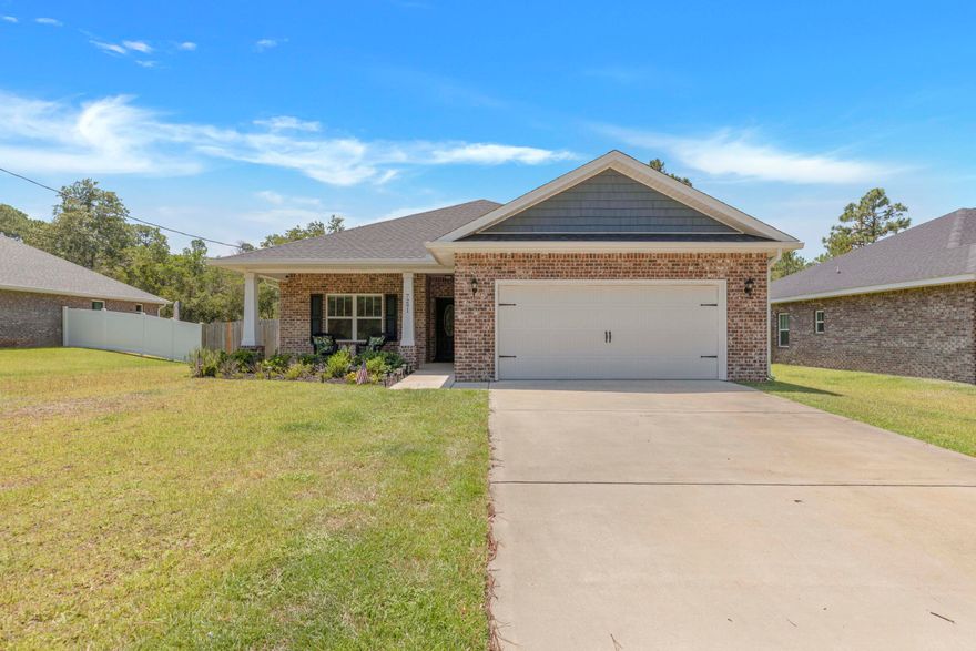 PRICE IMPROVEMENT!!  Motivated Sellers!  This is one of the BEST DEALS IN NAVARRE!!  This beautiful 3 bedroom 2 bath, brick home, built in 2020, is a short drive Hurlburt Field, the beautiful Navarre Beaches, shopping and entertainment!  This home is complemented with a Large Living Area, Dining Room, Trey Ceilings, Crown Molding, Luxury Vinyl Plank flooring, Custom Tile in Wet Areas, Custom Shower and High Quality Finishes throughout the home. Spacious master suite with large master bath, his and her closets, bidet, screened-in patio, custom tile shower with dual heads, garden tub, and dual sinks.The kitchen opens up into the main living area and includes solid wood cabinets with soft close doors & drawers and granite countertops. Washer and Dryer Convey!!