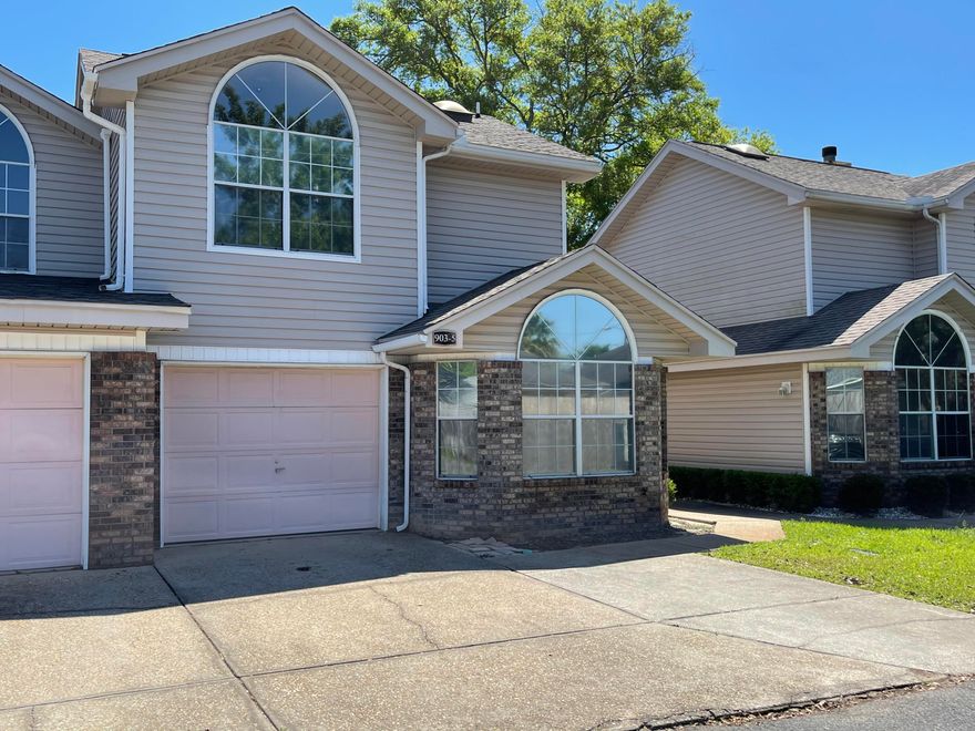 Adorable 3 Bedroom 2 bath end unit townhome on a private dead end street. As you enter you are greeted with a large open living area with New paint and tiled floor throughout the first floor.  Master suite located on the first floor with lots of natural light from the custom arch windows. Kitchen features include black appliances that pair well with the Dark cherry oak stained cabinets. To the right of the kitchen you have a large formal dining area beside the sliding glass door that leads to the cozy privacy fenced back yard.  Two additional  bedrooms upstairs and a guest bath.