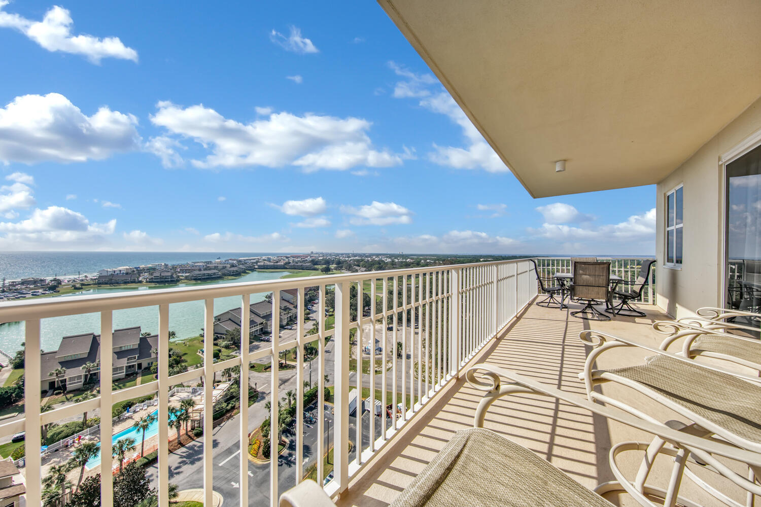Gulf VEWS, Bay VIEWS, Lake VIEWS and Golf Course VIEWS. This 3 BR, spacious, end unit is awe inspiring from virtually every room. Southside patio is large enough for both a Dining and a Observation-seating area and a Northside patio that's the perfect tranquil hide-away.With more than 1700 sq ft, this condo will feel more like a house. Updated, coastal-elegant decor creates a clean, contemporary feel that will be appreciated by all. Phenomenal amenities including stunning lobby area, 3 swimming pools, golf, tennis, fitness center, 4 elevators and an on-site restaurant w/ live entertainment. Impressive Rental Projections! HOA covers all utilities except electri