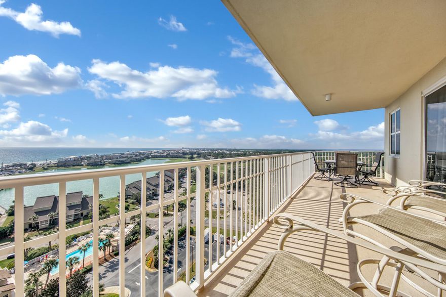 Gulf VEWS, Bay VIEWS, Lake VIEWS and Golf Course VIEWS.  This 3 BR, spacious, end unit is awe inspiring from virtually every room.  Southside patio is large enough for both a Dining and a Observation-seating area and a Northside patio that's the perfect tranquil hide-away.With more than 1700 sq ft, this condo will feel more like a house.  Updated, coastal-elegant decor creates a clean, contemporary feel that will be appreciated by all.  Phenomenal amenities including stunning lobby area, 3 swimming pools, golf, tennis, fitness center, 4 elevators and an on-site restaurant w/ live entertainment.  Impressive Rental Projections!  HOA covers all utilities except electri