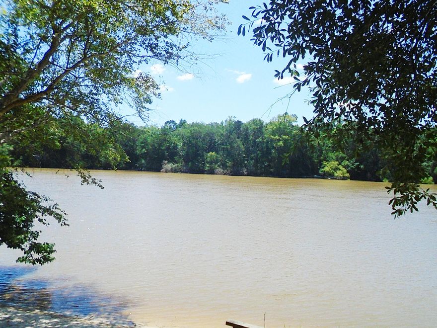 PRICE REDUCED!!! If you are looking for a place on the River to escape the hustle and bustle of a resort community or a place for the whole gang to vacation, This is it!!!! This 2 bedroom cabin is furnished to sleep at least 8. It has over 76 ft on the river with steps down to the white, sandy beach. 278 sq ft of deck facing the River to enjoy the views of the lazy, river afternoons. Home has central air and heat. County boat launch is on the same road. Easy to have boat at your shoreline. Cabin is being sold furnished including all the dishes, washer/dryer and more. Home is just a quick 10 minute drive to Northwest Florida International Airport and a 20 minute drive to Panama City Beaches and Pier Park. Property across the river is State Land and will not be developed.