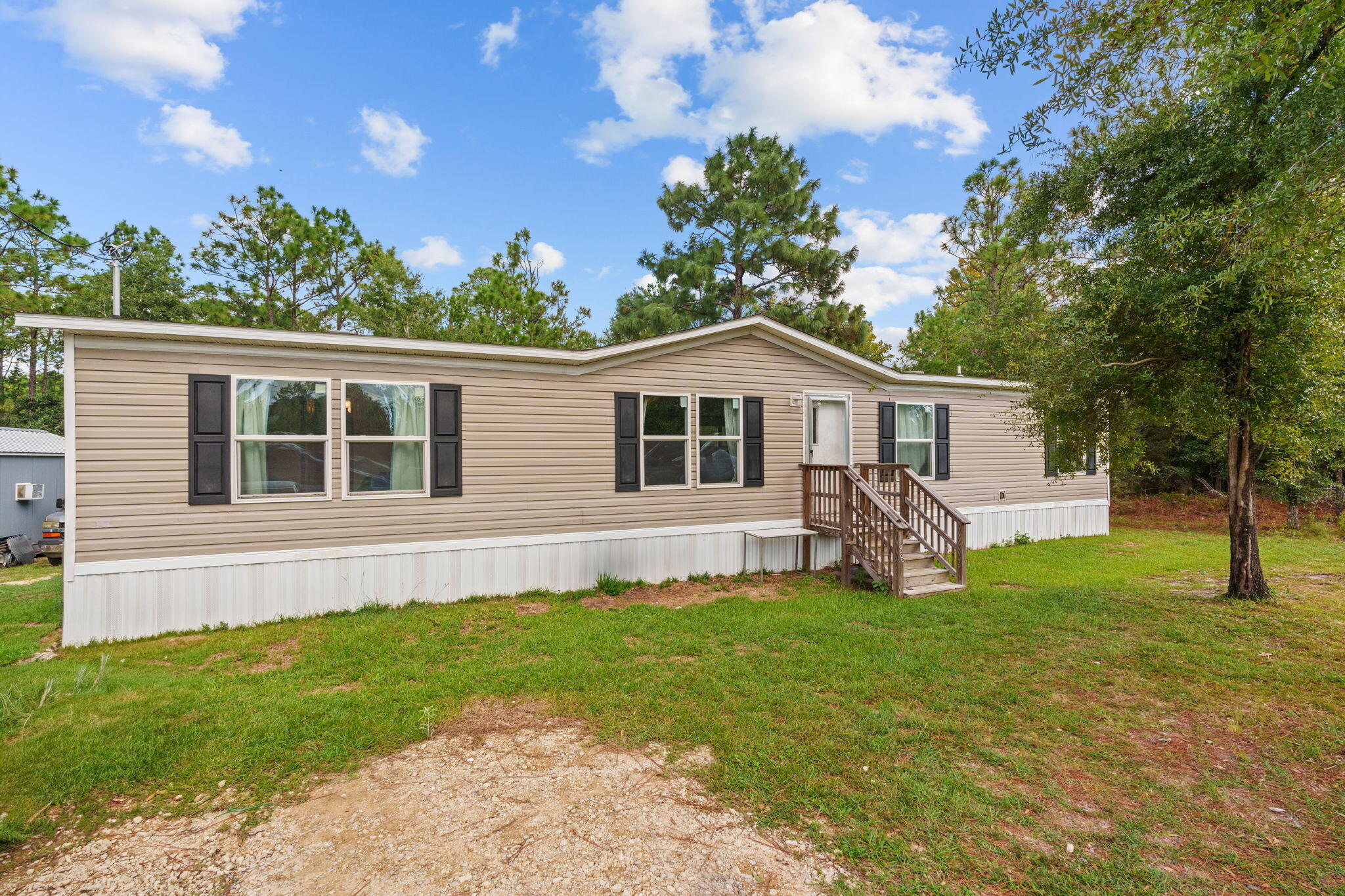 This stunning 4 bedroom, 2 bathroom home is nestled on a spacious 0.34-acre lot offering both comfort and style. As you step inside you're greeted by luxurious vinyl plank flooring that flows seamlessly throughout the open concept living spaces. The kitchen features a wonderful island that doubles as a breakfast bar. Only a 15 minute drive from downtown DeFuniak Springs and one hour from the Emerald Coast's beautiful white sand beaches.