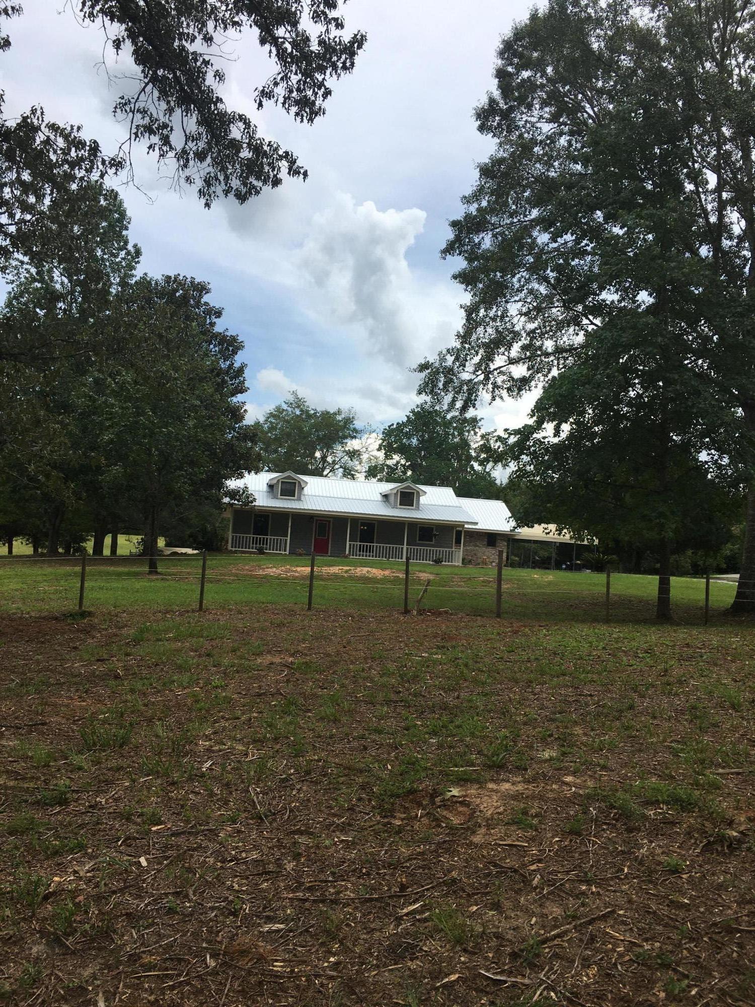 Beautiful renovated home located on 9 acres. Comes complete with a 32x60 barn with stalls, a detached garage/workshop with a covered carport behind it. Garage has 2 garage doors with auto openers.Home is a split floorplan with 3 bedrooms and 2 baths. All bedrooms have large closets. Kitchen is equipped with 2 pantrys, new appliances, granite counter tops and a large breakfast bar. Small office space between Kitchen and Master bedroom. The family room is large enough to make a man/woman cave which opens to the back deck. Driveway is shared with neighbors.Back corner property line does go into the wooded area. New paint, flooring, sinks, vanities, and toilets. Refrigerator is about 2 yr. old. All matters of importance should be verified by buyer. Pics coming soon.