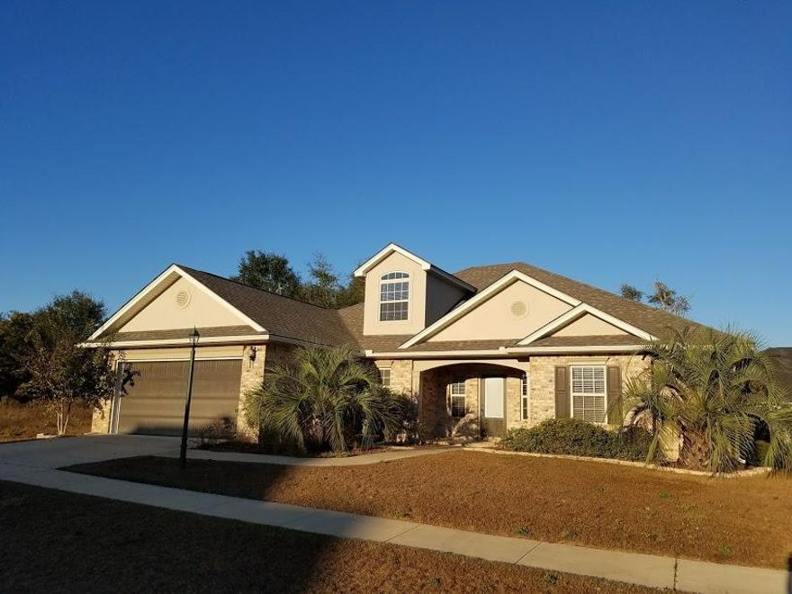 You'll love this home! It's located on the south end of Crestview in a gated community on a corner lot. Home features a spacious split floor plan with wood floors in the foyer and living room and tile in all the wet areas. Kitchen features granite counter tops and tumbled stone back splash as well as walk-in pantry. Master bedroom features a large walk in closet and master bath features a large corner tub and separate shower as well as large separate vanities. Additional bedrooms feature Jack and Jill bath. Home has many other great features like the screened back porch, large bonus room up stairs and spacious laundry with sink. You'll be glad you made this house your home.