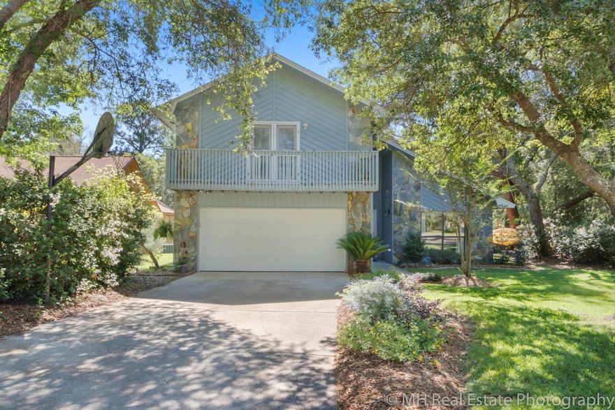 Welcome to this updated Bluewater Bay lakefront 3 bed 2.5 home with multiple living spaces both inside and out. Inside features newer kitchen cabinets with GRANITE counters and a custom tile backsplash. The floor plan flows beautifully and functions well for entertaining with multiple living spaces and access to the newly built deck with ample seating. The yard is sure to please with a path to the lake and a newly created fire pit area. Mature landscaping on this .38 acre lot as well as planted beds add to the appeal. Back inside, the upstairs master bedroom is spacious with 2 closets and a private balcony. The newly renovated master bath features new lighting and double vanities. There are 2 more bedrooms and a bath upstairs. Set up your appointment to view this lovely home today.