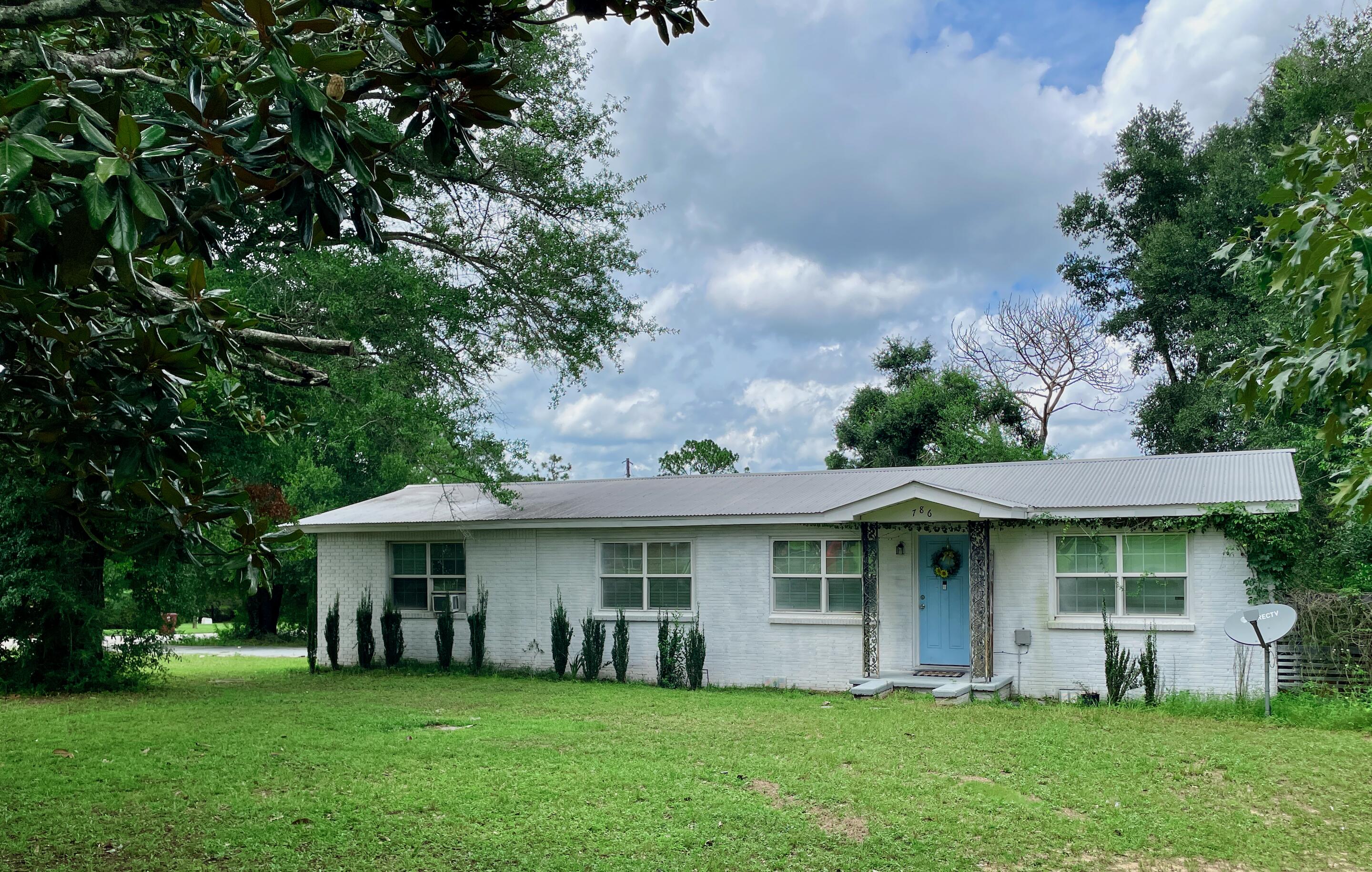 **Investor Special in the Heart of Crestview!**This 1956 off-grade brick home sits on a spacious 1/2 acre corner parcel made up of two lots, offering the potential to subdivide the additional lot for resale or new construction. There is also plenty of room to park your RV or boat, and no HOA. This property is a great opportunity for cash investors or buyers using conventional financing or renovation loan who are looking to add equity through renovations.Previous listing states that major updates were completed in 2019, including a durable metal roof, HVAC system, and a refreshed kitchen. However, the home now needs repairs and cosmetic updates to bring it back to its full potential. Notable issues include wood rot around some door frames, poorly installed flooring with visible gaps, peeling exterior paint, a couple of water stains on ceilings, needs full interior paint job and exterior pressure washing, and has peeling laminate countertop in the kitchen (the kitchen island has beautiful granite in good condition). Additional general updates are needed throughout.
This is a solid structure with great bones and loads of potential, especially given the large lot and possible subdivision opportunity- call the City zoning office to verify if allowable for your particular plans. Whether you're looking to renovate and resell, build an additional home, workshop or accessory dwelling unit, or create a long-term rental, or make this your new home, this property offers flexibility in a convenient Crestview location. Call the city zoning office to verify if any potential lot split or addition of other structures is allowable.
Being sold as-is. Cash or conventional financing only. Don't miss this value-add opportunity!