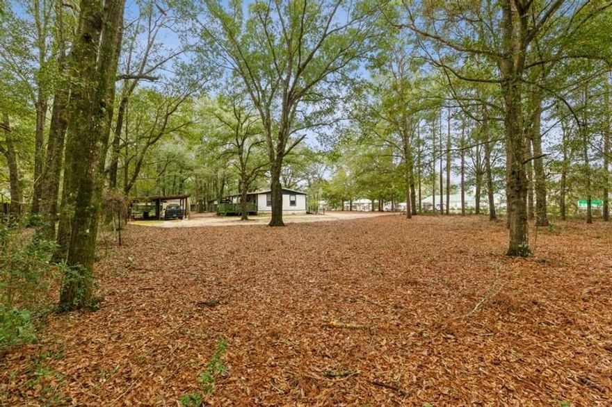 Location, Location, Location! Don't miss out on this amazing opportunity to build new single family or multi-family homes. Or make this home your own. It's within minutes from highway 90 and the future Crestview Bypass, that gives access to Crestview Commons shopping. Home has been freshly pressure washed for the new owner and is handicap accessible. Camper has been removed.