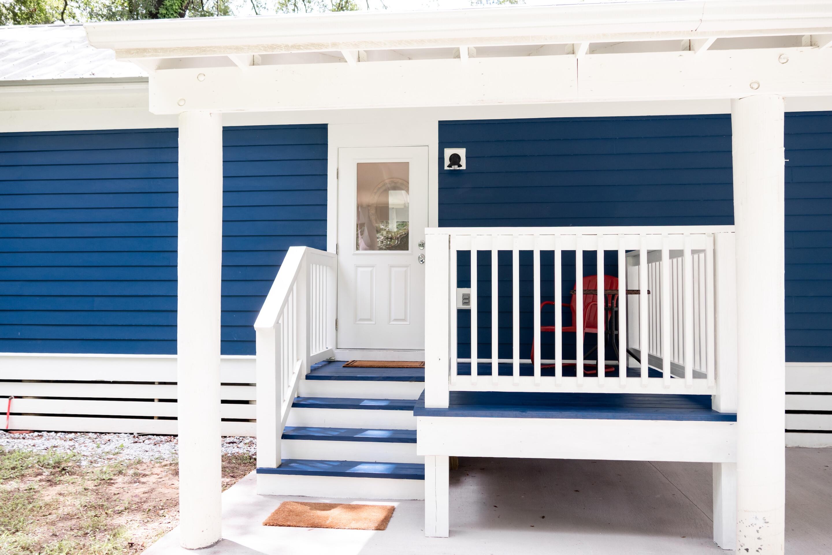 LET IN THE SUNSHINE in this charming stick-built Florida cottage on pilings! Lovingly maintained as a second home for the past two years, this cozy retreat is surrounded by lush new landscaping, some thoughtfully placed for added privacy.Inside, you'll find 2 bedrooms and 1 bath with beautiful vinyl plank flooring throughout and an inviting open-concept layout. The kitchen shines with stainless steel Whirlpool appliances, shaker-style cabinets, and quartz countertops, while the spacious bathroom boasts a gorgeous tiled shower.Enjoy endless hot water with the electric instant water heater; perfect after a day at the beach, which is just a quick 30-minute drive away.Call today to schedule your private showing!