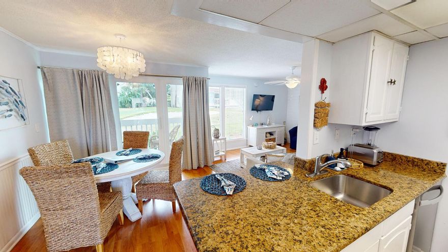 Turn-Key Rental Machine in Prime Destin Location!  Discover the perfect blend of income potential and vacation retreat with Unit 1038, situated in one of Destin's premier gated communities. This exceptional condo generated over $40,000 in rental income in 2023, with bookings already lined up for summer. Highly praised by guests, this upgraded unit offers numerous enhancements including durable flooring, stylish furniture, modern lighting, and charming coastal decor. Fully furnished and beautifully decorated, the unit also includes a washer and dryer for added convenience.  The hot water heater was just replaced this year, so no insurance issue there!  Location is key, and Unit 1038 doesn't disappoint. Nestled alongside the 9th hole of the Sandpiper Cove Par 3 Golf Course, you can enjoy