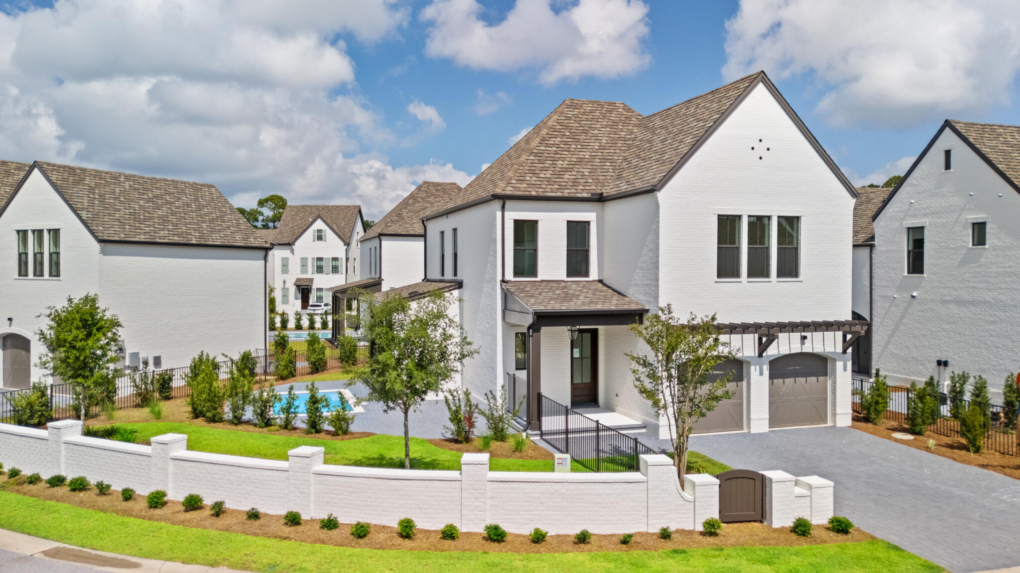 Welcome to the epitome of luxury living in the exclusive RidgeWalk community, just moments away from the pristine beaches of 30A. Nestled within a gated, non-rental enclave, this exquisite Normandy floor plan offers a lifestyle of sophistication and comfort.Step into the inviting living room, where a sleek linear fireplace takes center stage, flanked by two doors leading to the outdoor porch. Entertain with ease as you grill up delights on the built-in grill, or take a refreshing dip in the private pool, creating cherished memories with loved ones against a backdrop of serene surroundings. The heart of the home, the kitchen, is a culinary masterpiece. Woodharbor cabinets stretch to the ceiling, providing ample storage space, while upgraded Cambria countertops offer both elegance and functionality. Fulgor Milano appliances elevate your cooking experience, and a stunning marble backsplash adds a touch of glamour. Adjacent to the kitchen, a working pantry and drop zone lead seamlessly to the two-car garage, ensuring convenience in your day-to-day activities.
Ascend the elevator to the second floor and discover the lavish primary suite, a sanctuary of comfort and style. Vaulted ceiling adorned with cedar beam and ship lap create an atmosphere of tranquility, while a custom-designed closet by Tailored Living offers organization and sophistication. Indulge in the spa-like bath, featuring a crushed stone tub accented by a gorgeous fluted 3D honed tile feature wall, promising moments of relaxation and rejuvenation.
Two additional guest bedrooms, connected by a convenient Jack and Jill bath, provide comfortable accommodations for family and friends. A well-appointed wet bar adds a touch of luxury, perfect for entertaining guests or enjoying a nightcap before retiring for the evening.
Experience the pinnacle of coastal living in this exceptional Normandy floor plan, where every detail has been thoughtfully curated to exceed your expectations. Don't miss your opportunity to call this exquisite residence home. Schedule your private tour today and embrace the lifestyle you deserve in RidgeWalk.