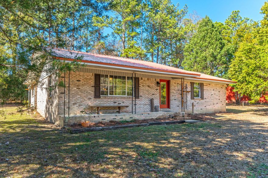 Welcome to this beautifully renovated 3-bedroom, 2-bathroom home on 4 acres. Tastefully updated in 2019, the home boasts tile flooring throughout, custom cabinetry, sleek quartz countertops, and stainless steel appliances in the kitchen. The spacious master bedroom features an oversized closet with custom wood shelving, while the master bath offers a luxurious custom tile shower complete with a rain head for a spa-like experience.The Florida room, currently being used as the third bedroom, offers flexible living space and could easily revert to a charming Florida room for those who enjoy outdoor views year-round. Throughout the home, upgrades to the trim and baseboards were made using cypress wood, adding warmth and character to every room. Additional updates include new fixtures and outlets throughout, plus a tankless hot water heater for energy efficiency.

The home is equipped with modern systems, including a roof replaced in 2019, a well pump installed in 2024, and a septic system upgraded in 2018, ensuring peace of mind for years to come.

Outside, the property is equally impressive. The owners have a cleared a beautiful walking path around the entire property to enjoy. A large, enclosed 30' x 45' workshop stands ready for any project, with a 20' covered porch, 2 rolling 10' doors, and full insulation. It's equipped with water, power, and sewage, making it an ideal space for a variety of uses. At the back of the workshop, you'll find a self-contained apartment with a full bathroom, washer and dryer, and a separate entrance perfect for guests or as a private retreat. There is also a pole barn ready to house your RV complete with gravel, a 30 amp electrical service, water and sewer. There is a paver pad on the back part that could be converted to an outdoor kitchen. A third barn on the property is equipped with power and a generator hookup, provides additional storage space, completing this exceptional property.