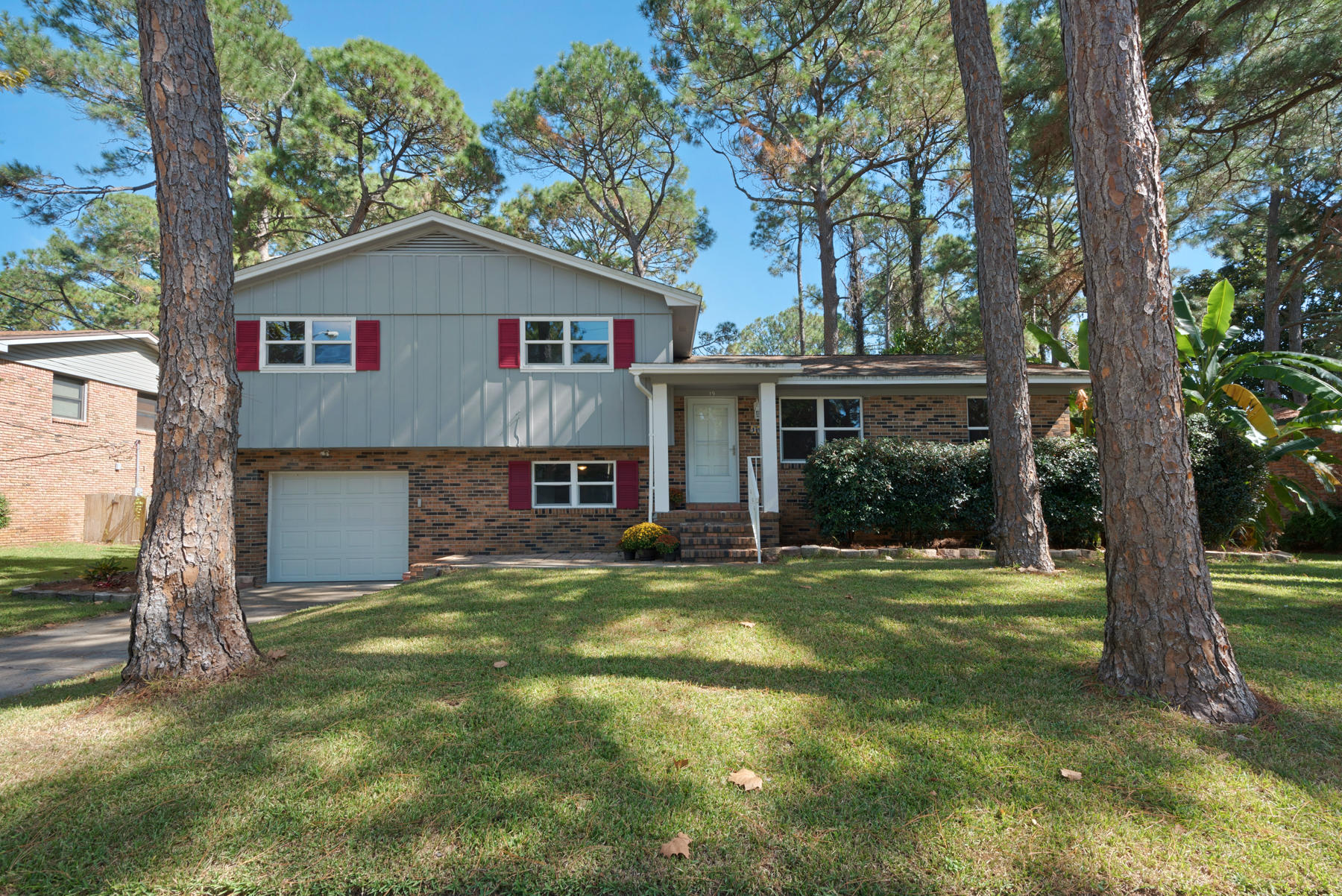 19 Driftwood Ave A MOVE IN READY HOME located in a quiet neighborhood on a sidewalk lined street. The interior of this well-loved tri-level home has been recently painted, new copper wiring installed by EIM, updated kitchen with island, a new microwave, new dishwasher and updated bathrooms. The kitchen/dining/living space is open and spacious with lots of possibilities for family living. Down a -1/2 level, off the kitchen is a great family room w/fireplace, a -1/2 bath and access to the patio and huge fenced in back yard. On the other side of the kitchen,(down -1/2 level) is a bonus/flex room and the laundry room with easy access to the 1 car garage and the backyard. Lots of extra storage located in the bonus room and garage. Up a -1/2 level, the master bedroom has its own private bath wi