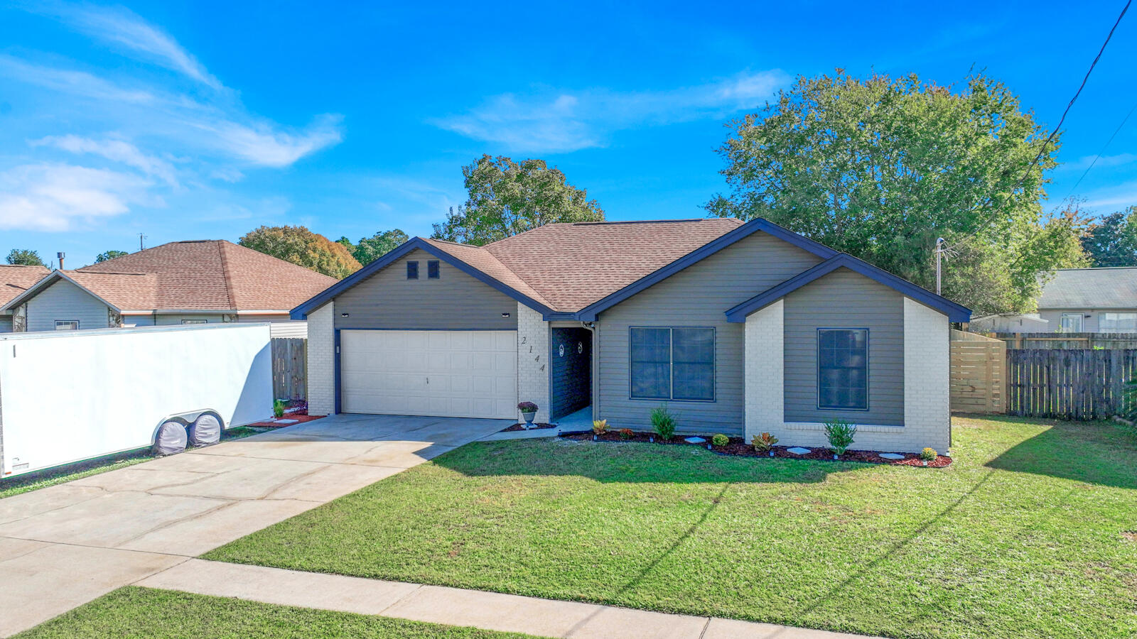 Welcome to this Beautifully Updated 3-Bedroom, 2 Bath Home in Navarre! This stunning property features durable tile and luxury vinyl plank (LVP) flooring throughout, and a modern kitchen with granite countertops and newer appliances. The vaulted ceiling in the living area adds to the spacious feel. Both bathrooms have been updated along with fresh interior and exterior paint makes this home truly move-in ready. Step outside to enjoy the covered patio and a large backyard with room for a pool, enclosed by a new privacy fence. The roof was replaced in 2021, and the HVAC system was installed in 2011. Plus, you'll have peace of mind with an American Home Shield Warranty valid until March 2025. Located just minutes from Hurlburt Field, Navarre's beautiful beaches, top-rated schools, shopping, and the fishing pier. This home offers convenience and comfort. Don't miss out on this gem!