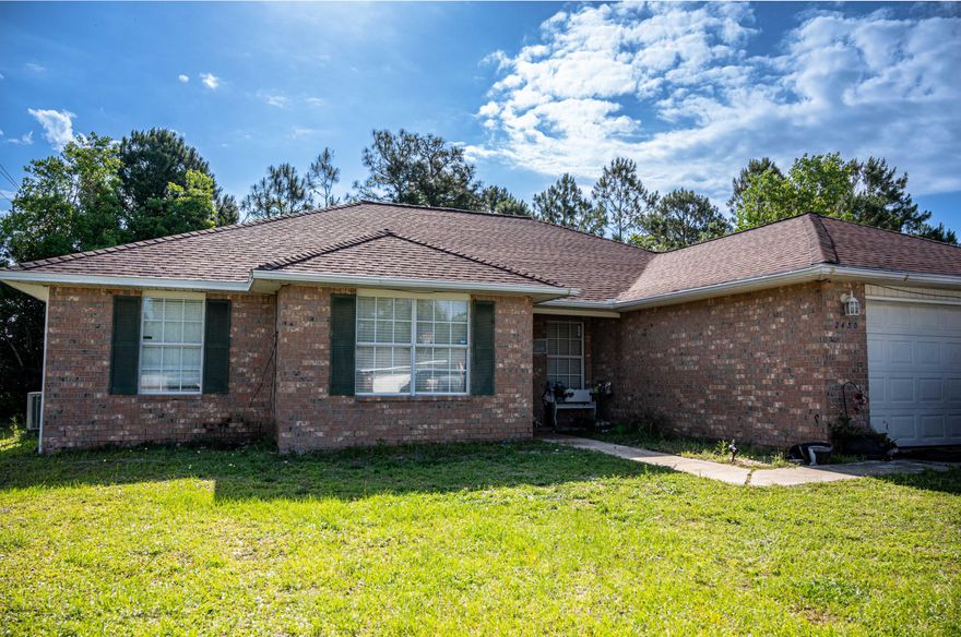 Located in the heart of Navarre and walking distance to Navarre High School, this large 4 bedroom 2 bath home is ready for new owners. Built in 1999, this split bedroom design home has new newer flooring, granite in the kitchen, some appliances and a large yard! Be minutes from Navarre Beach, the bay, or on your way to interstate access north of HWY 87. This home is ready for new owners and a special touch.