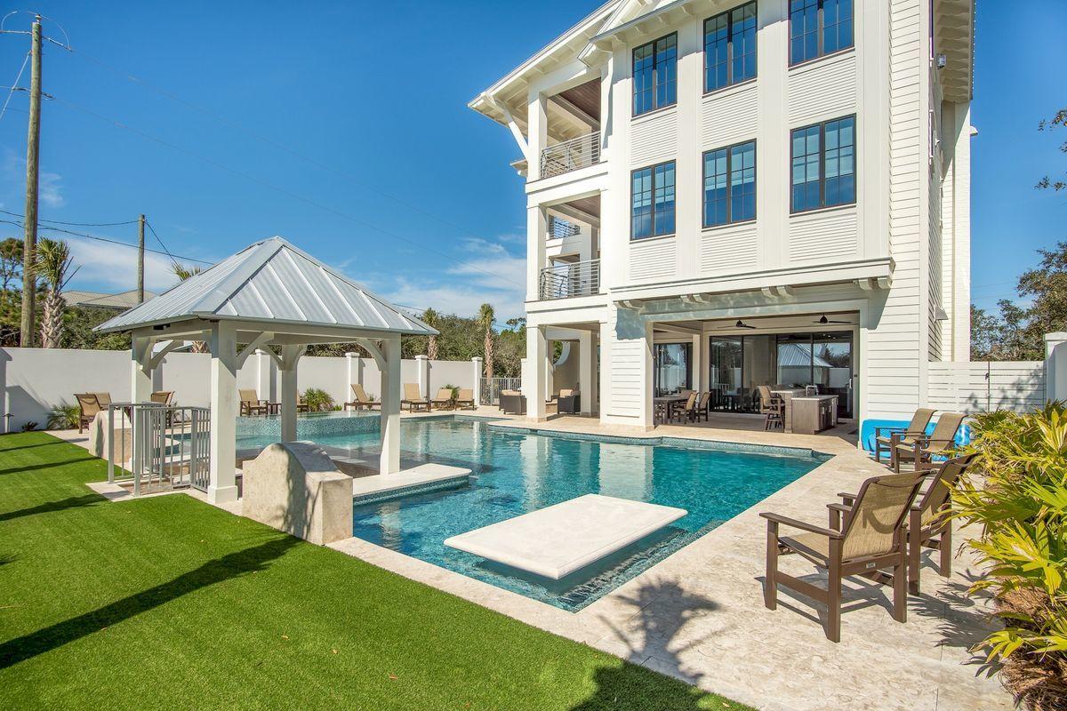 Dubbed ''La Piscina,'' which translates to ''the pool'' in Spanish, this contemporary Seagrove retreat's outdoor oasis boasts the largest private pool on Scenic Highway 30A and more than 2,600 feet of covered balconies and outdoor living space. But, that's just the beginning. Situated directly on 30A, this four-story masterpiece built in 2018 is just one tier off the gulf, making sandy, salty days on the beach just a few steps away and water views a reality throughout. The first floor of the home, which boasts more than 7,000 square feet total, is all about relaxing and entertaining, with a large game room and common area with wet bar overlooking the pool. Breakaway doors make it possible for guests to seamlessly enjoy both indoor and outdoor experiences. The second floor, like the first,