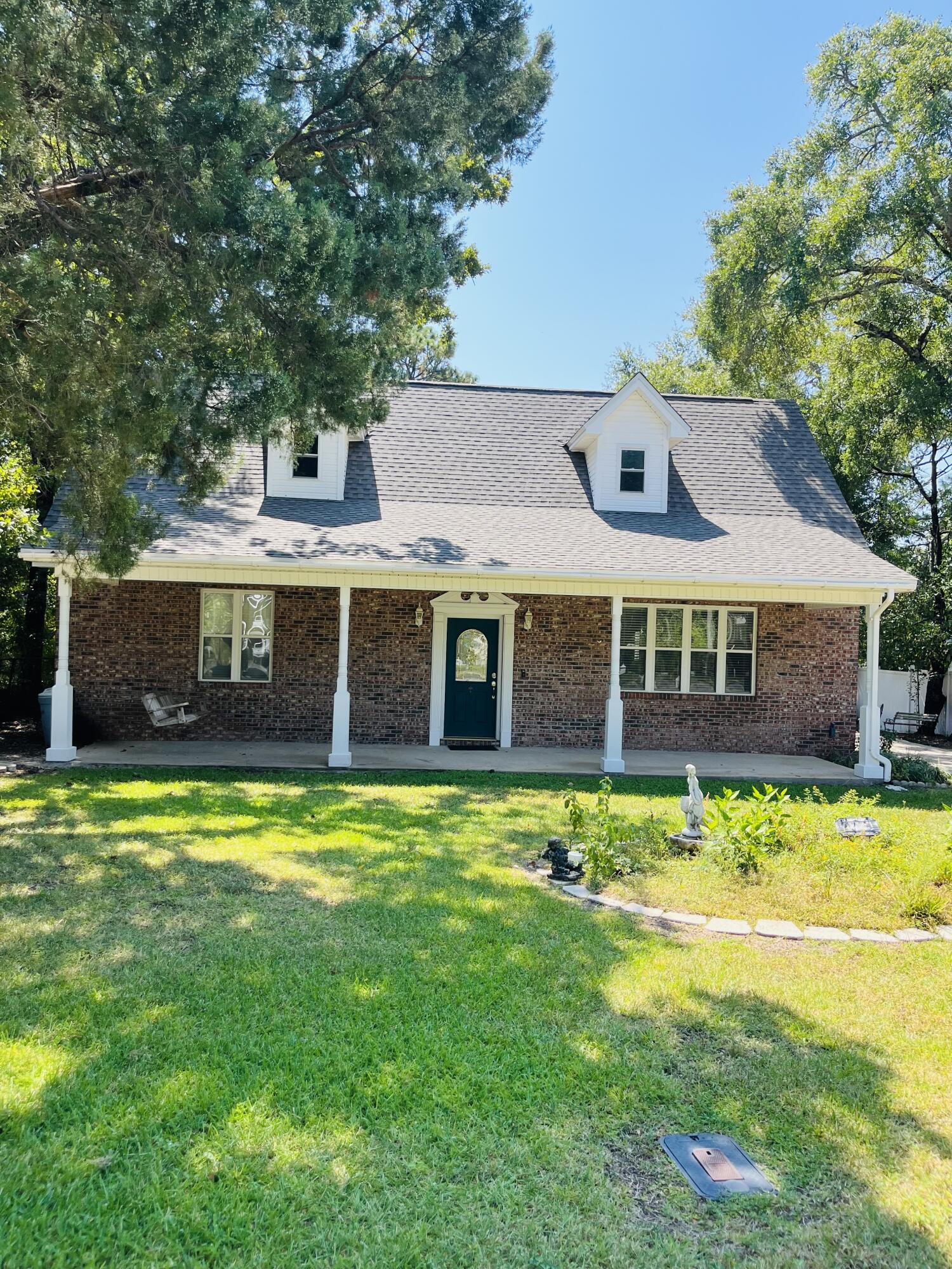 Brand NEW ROOF on house & garage! NO insurance worries here. This traditional brick beauty is packed with features and a great location! Only 1 mile to Florida Park and Boat Ramp, 2 miles to Eglin AFB and 2 miles to Turkey Creek, there's also 2 neighborhood parks around the block! This property sits on a .25 acre lot with vinyl fencing and a large (24x34) combination garage/workshop. Step inside this thoughtfully designed home and you'll notice tile floors, high ceilings, gas fireplace, an office space, guest bath and laundry room. The spacious kitchen and dining area has a handy pantry, breakfast bar and shaker style cabinets. The downstairs main bedroom has a sitting room, double vanities and garden tub. This property includes an energy efficient geothermal HVAC too.