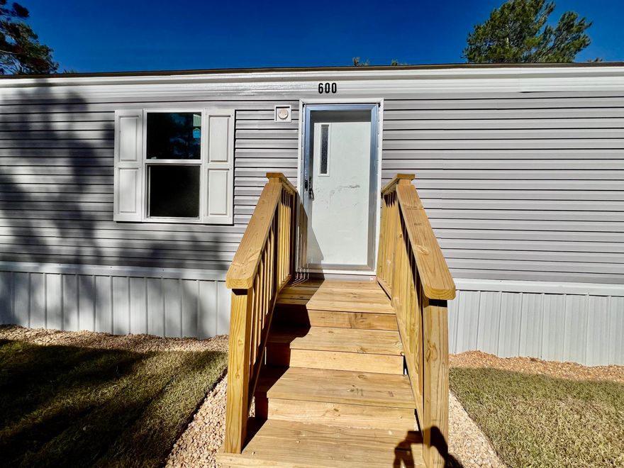 BRAND NEW 2 bedroom 2 bath single wide home.  The open concept layout features a spacious family room and kitchen, complete with a refrigerator and stove.  Both bedrooms and bathrooms offer plenty of space and comfort, while the home also includes washer and dryer hookups for added convenience.  Sitting on just under a quarter-acre, the level lot provides the perfect yard for kids to play or hosting family get-togethers.  Don't miss out on the chance to own a brand new home. Yard has a privacy fence for your kids and/or pets and will be finished by closing.  Buyer to verify all information and dimensions to their satisfaction prior to closing.