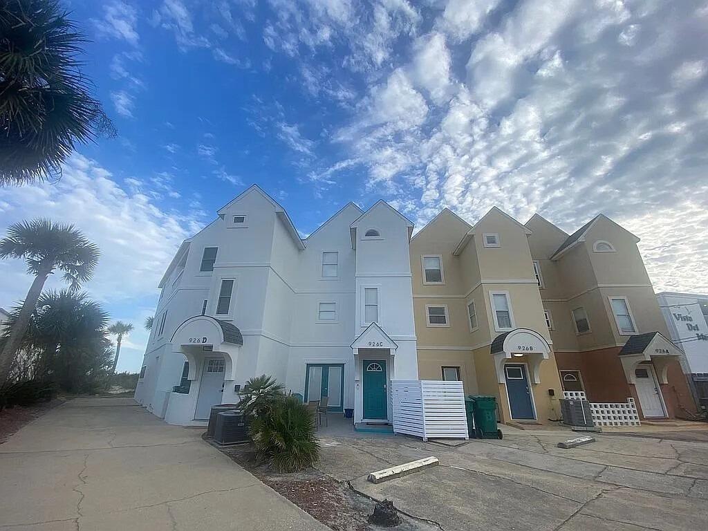 NO HOA, NO MONTHLY DUES, NO SPECIAL ASSESSMENTS! This beachfront townhouse offers incredible views and beach access. It's a DIRECT GULF FRONT, 4-bed, 3.5-bath townhouse on a private beach. Enjoy stunning water views from the living room and master bedroom balconies. The bottom floor has 2 bedrooms, a Jack-and-Jill bath, and patio access. The middle floor features the living, dining, and kitchen areas with stainless appliances. The third floor boasts a master suite with a private balcony and a fourth bedroom with an en-suite bath. Fully furnished with 2023 updates, including premium flooring and a hurricane-proof roof. With private parking and a rental projections between $130k-145k annually, this property is a gem on Okaloosa Island. Save over $15,000 - $20,000 yearly with no HOA dues!